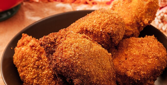 Muslos de pollo apanados